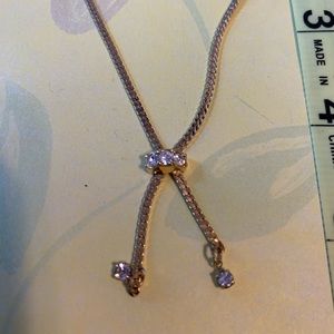 Beautiful gold tone bracelet with diamond like stones.